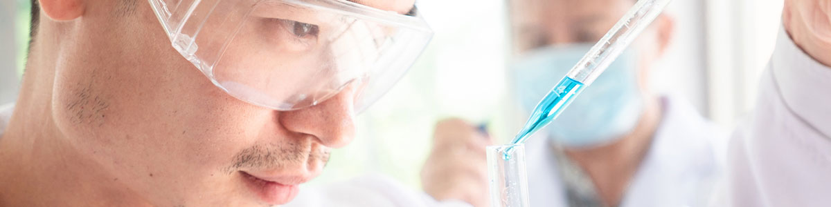 Scientist using pipette